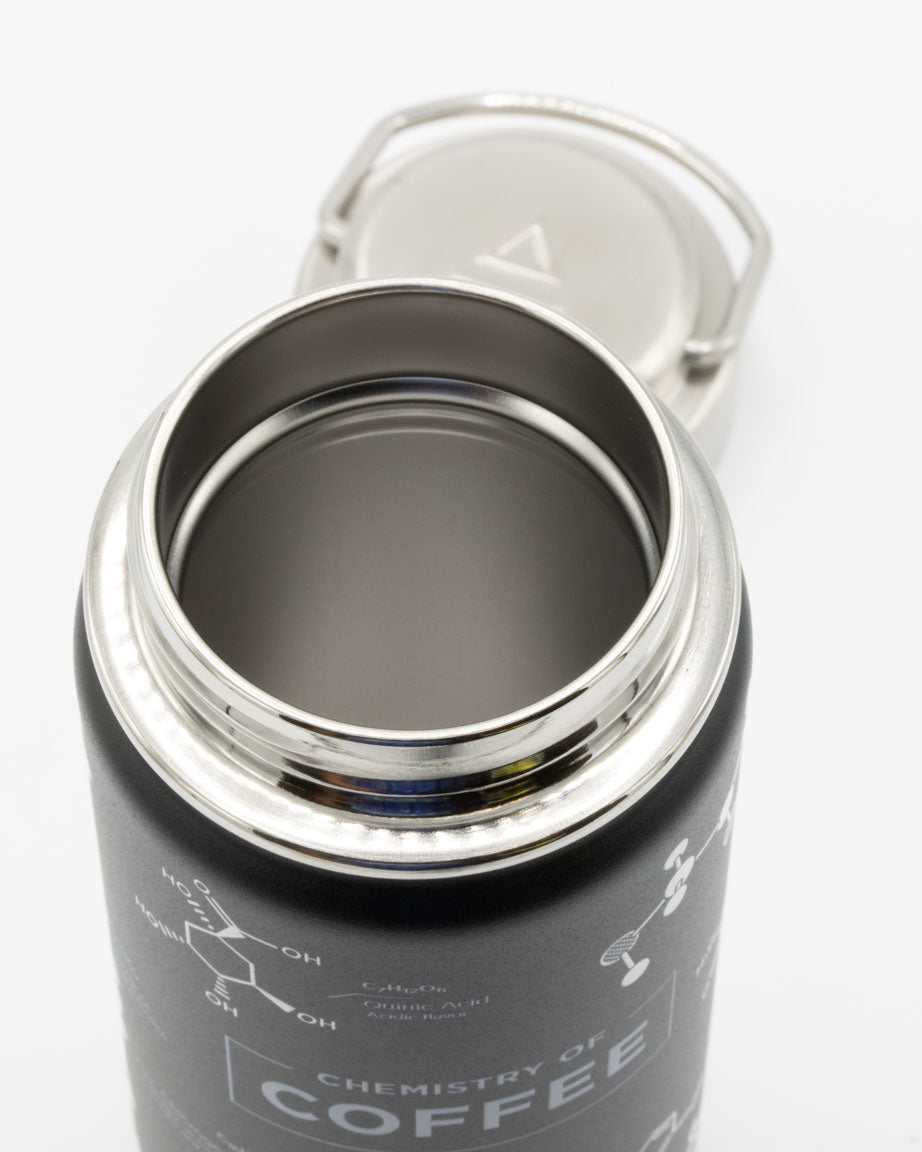 A Coffee Chemistry 18 oz Steel Bottle by Cognitive Surplus with a lid.