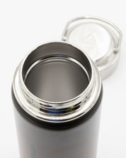 A Cognitive Surplus Desert Moon 18 oz Steel Bottle with a lid.