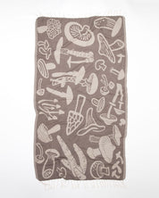 A brown Edible & Poisonous Mushrooms Turkish Towel with a mushroom design on it by Cognitive Surplus.
